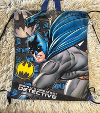 Load image into Gallery viewer, Batman drawstring bag, black background with blue handle, says "world's greatest detective"