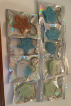 Load image into Gallery viewer, various colors including pink, blue, white in various shapes including stars, hearts, crowns, brown hanging cord, freshies